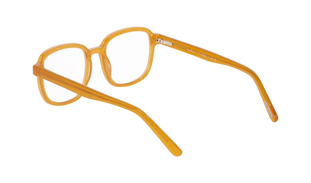 Frank and Lucie - Eyeknow glasses in Burnt Yellow, side-rear view showing warm-toned acetate and slim arms.