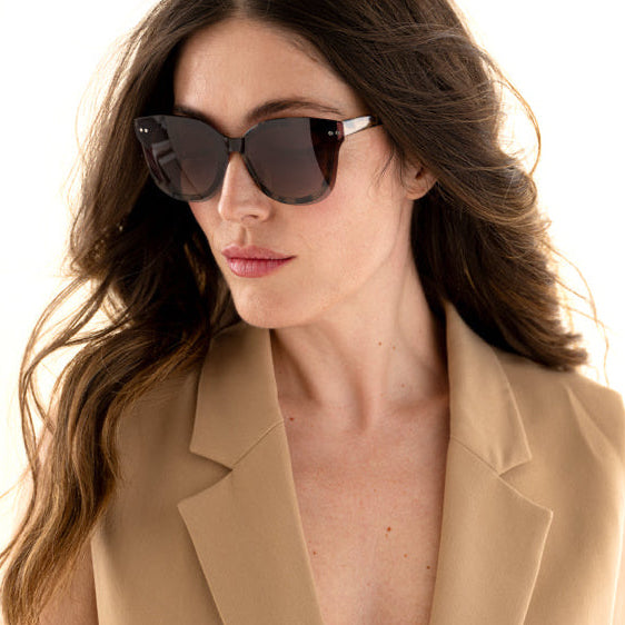 Woman wearing Frank and Lucie Eyedo Eclips sunglasses in Pretty Coat – timeless butterfly shape with gradient lenses